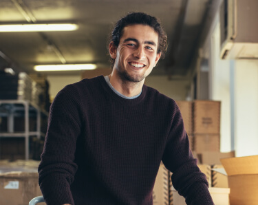 Man in black shirt smiling