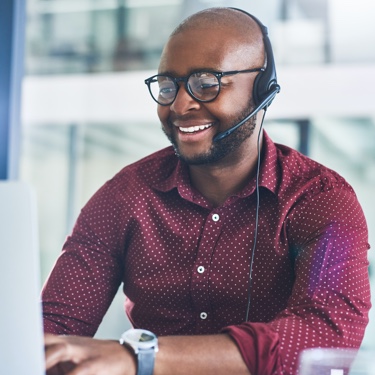 Call center receptionist working on laptop