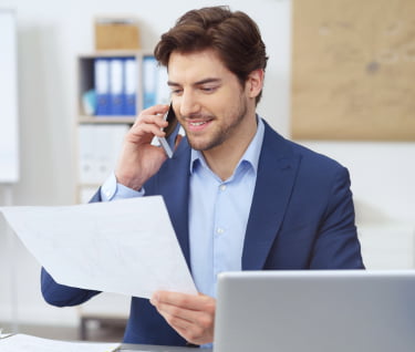 Man wearing coat looking into stats