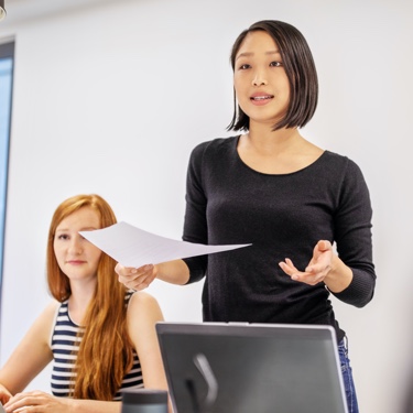 Woman presenting to group of people